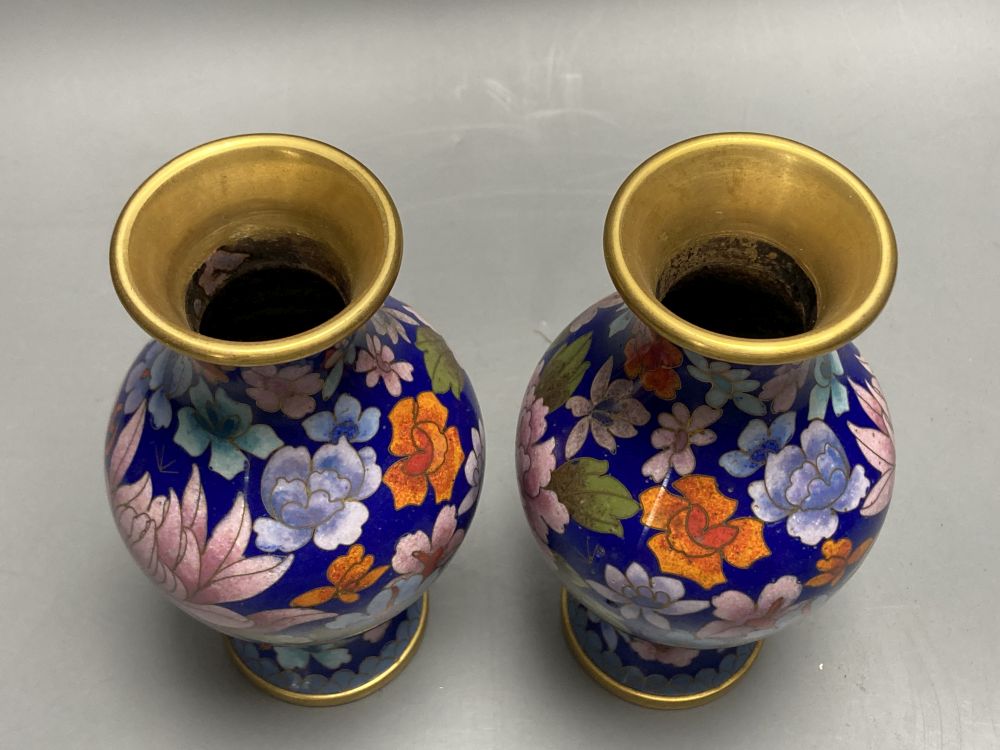 A group of Chinese wood stands and cloisonne enamel vases